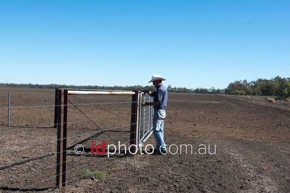 Farmer Jonathon Burrell opening gate at Trafalgar property, Dirranbandi, QLD